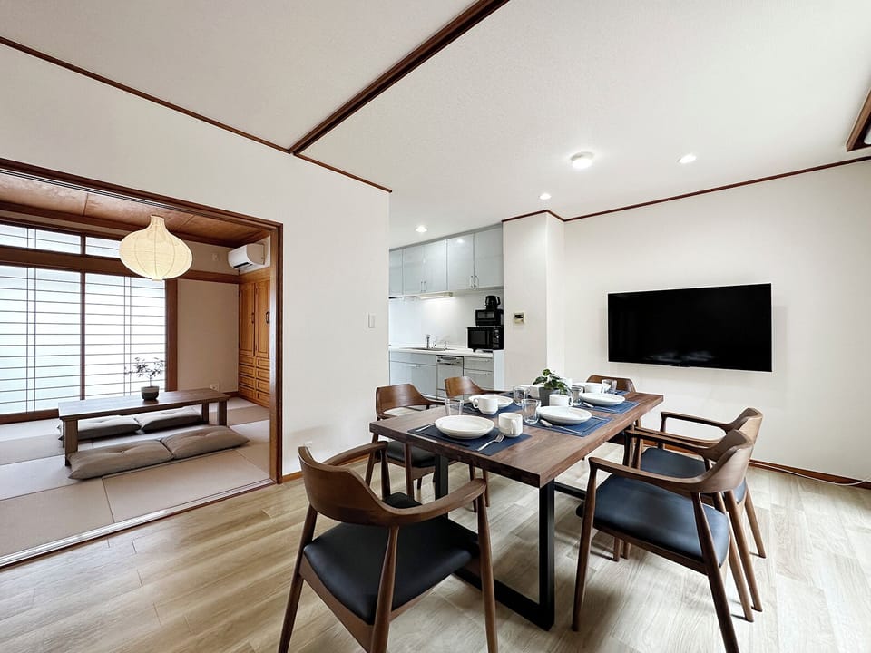 Deluxe Apartment, Balcony | Living area | 55-inch Smart TV with cable channels