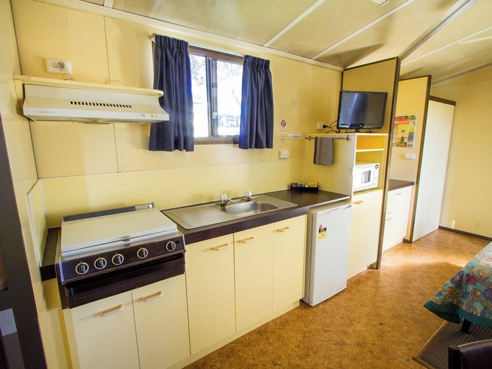 Standard Cabin - Pet Friendly | Private kitchen | Microwave, stovetop, toaster, cookware/dishes/utensils