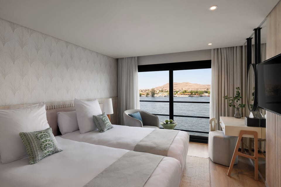 Deluxe Double or Twin Room, River View | Minibar, in-room safe, iron/ironing board, free WiFi