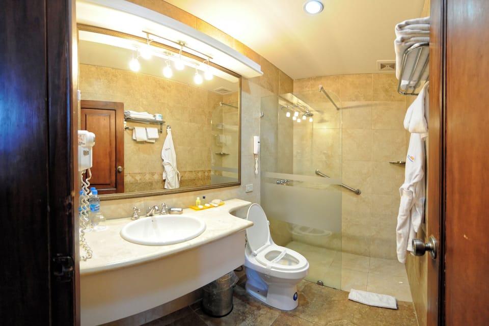 Superior Room | Bathroom | Hair dryer, towels, soap, shampoo
