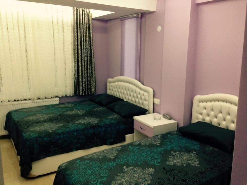Quadruple Room, City View | Desk, laptop workspace, iron/ironing board, WiFi (free)