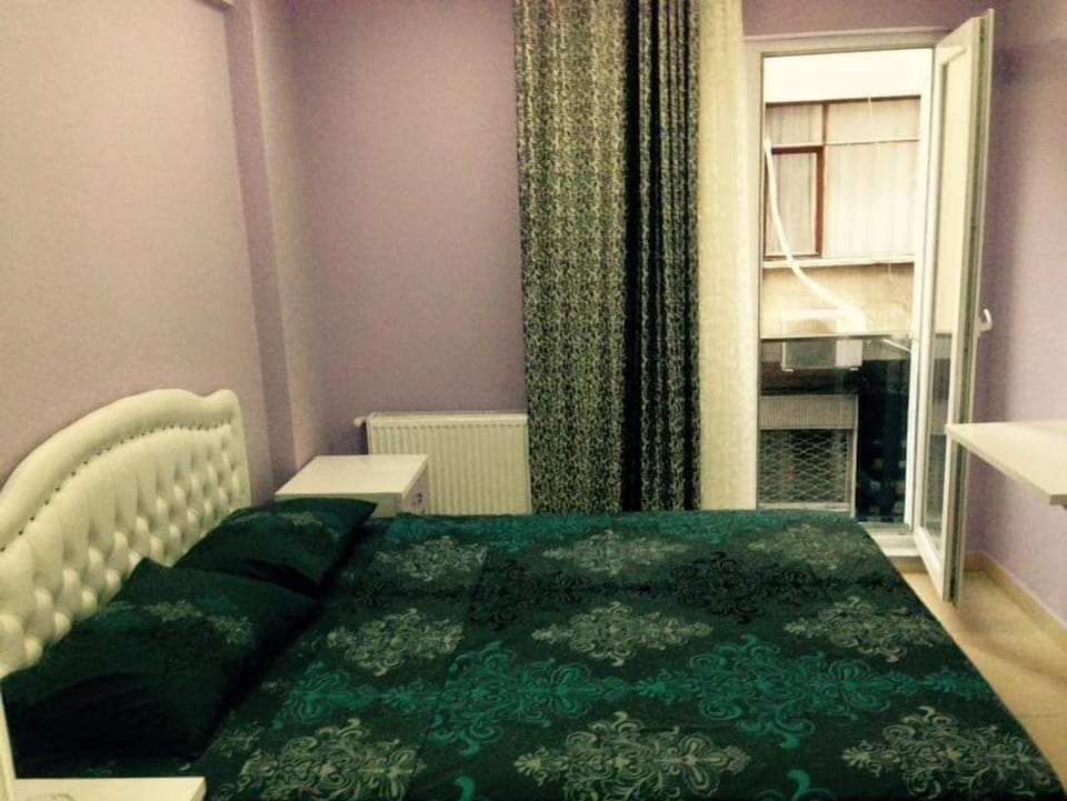 Quadruple Room, City View | Desk, laptop workspace, iron/ironing board, WiFi (free)