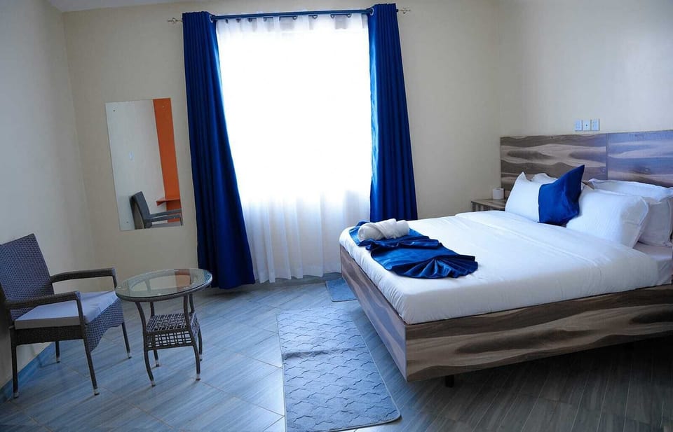 Deluxe Double Room, Courtyard View | Desk, laptop workspace, blackout drapes, free WiFi