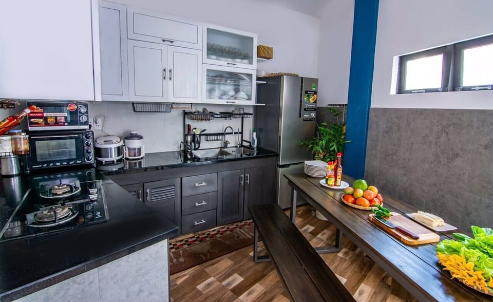 Mini-fridge, microwave, electric kettle, cleaning supplies