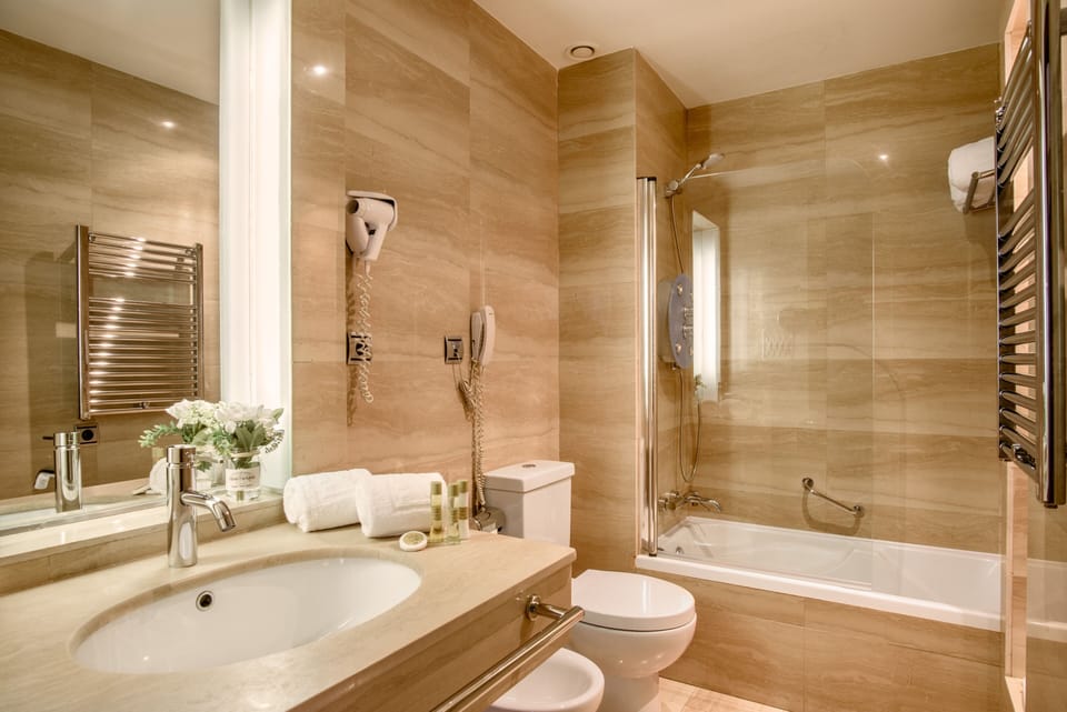 Eco-friendly toiletries, hair dryer, bidet, towels