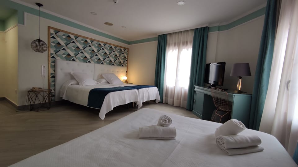 Family Room | Minibar, in-room safe, desk, iron/ironing board