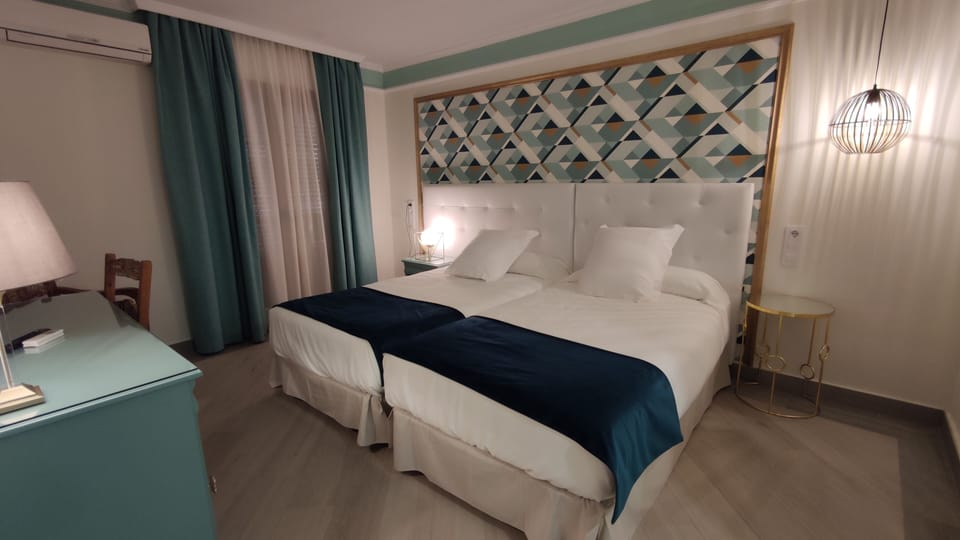 Standard Double or Twin Room | Minibar, in-room safe, desk, iron/ironing board