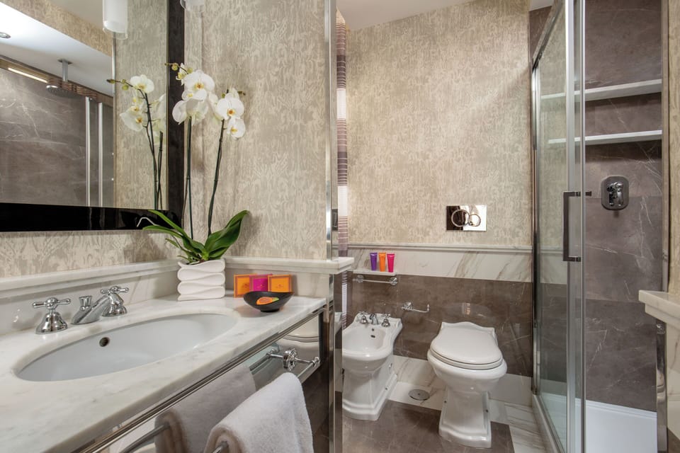 Deluxe Double | Bathroom | Shower, free toiletries, hair dryer, slippers
