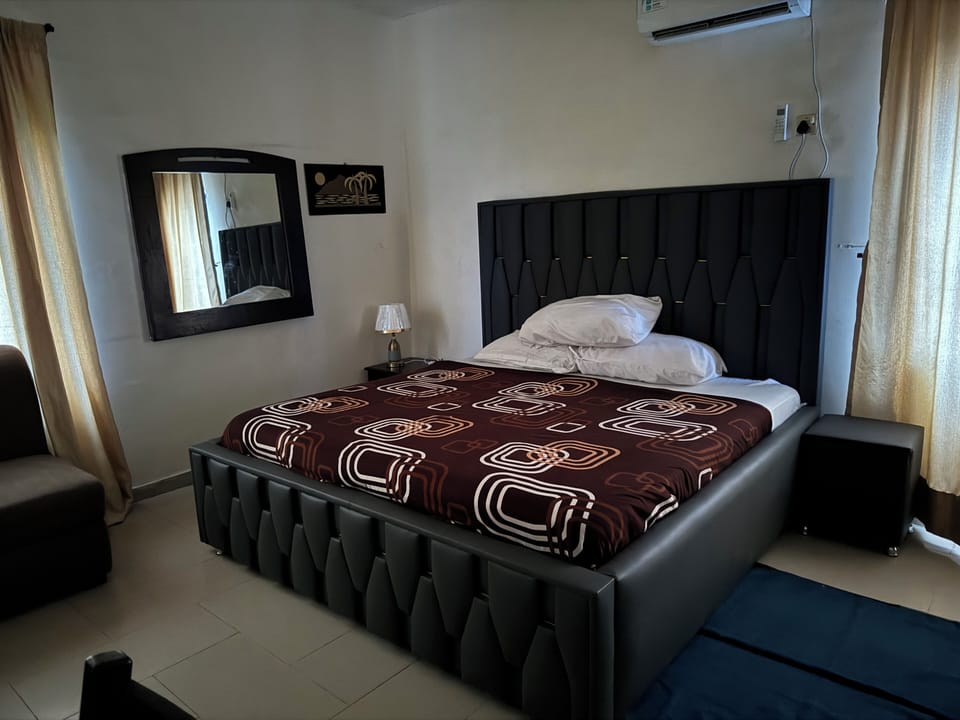 Desk, laptop workspace, bed sheets