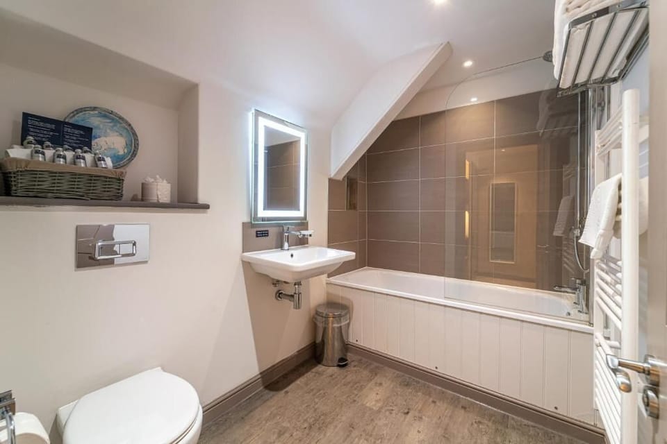Shower, hair dryer, towels, toilet paper