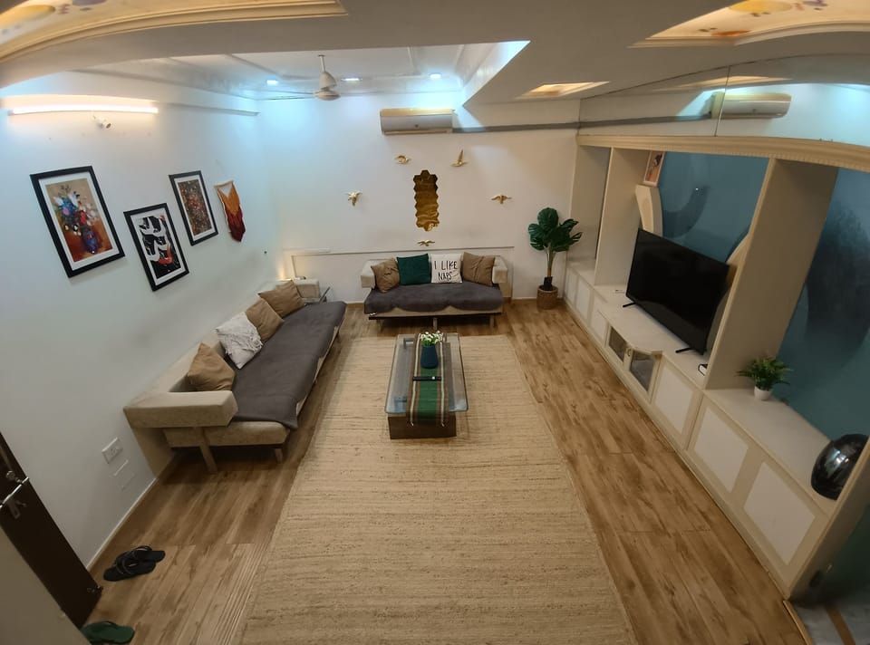Luxury Apartment | Living area | Flat-screen TV