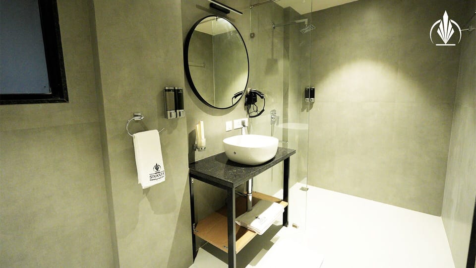 Shower, rainfall showerhead, hair dryer, towels