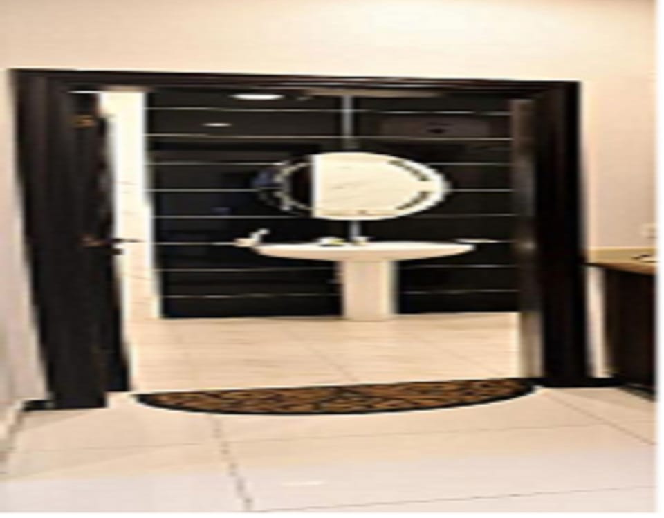 Bathtub, slippers, bidet, towels