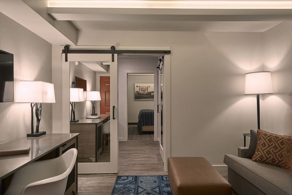 Suite, 1 Bedroom | Living area | 50-inch flat-screen TV with satellite channels, TV