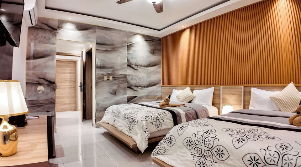 Deluxe Quadruple Room, Sea View | Select Comfort beds, minibar, in-room safe, free WiFi