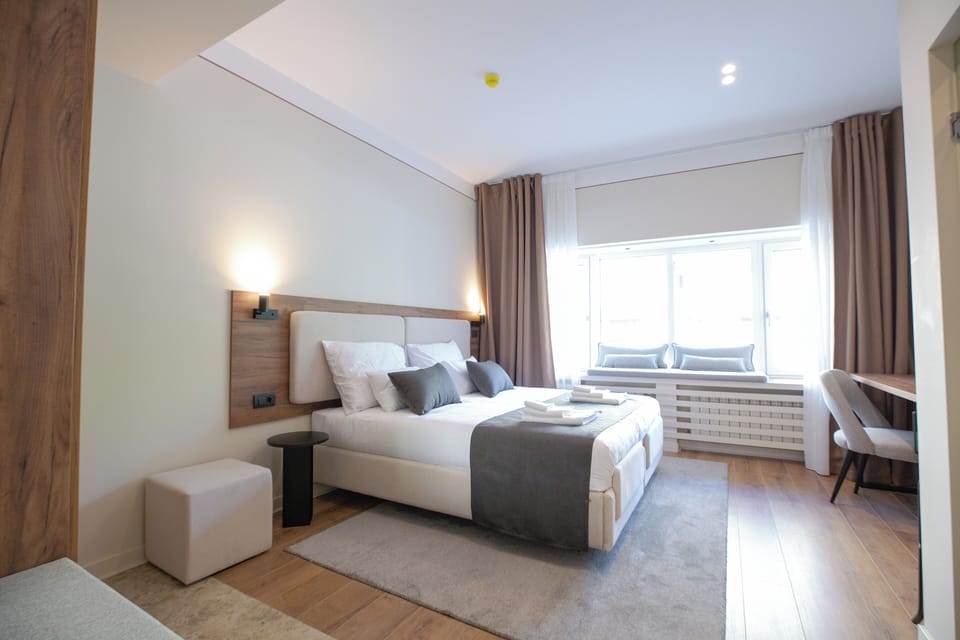 Standard Double or Twin Room | Living area | 52-inch flat-screen TV with cable channels