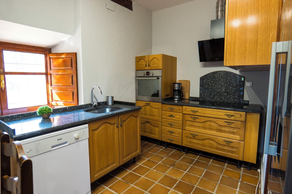 Family Apartment, Garden View | Private kitchen | Shared fridge, microwave, stovetop, cookware/dishes/utensils