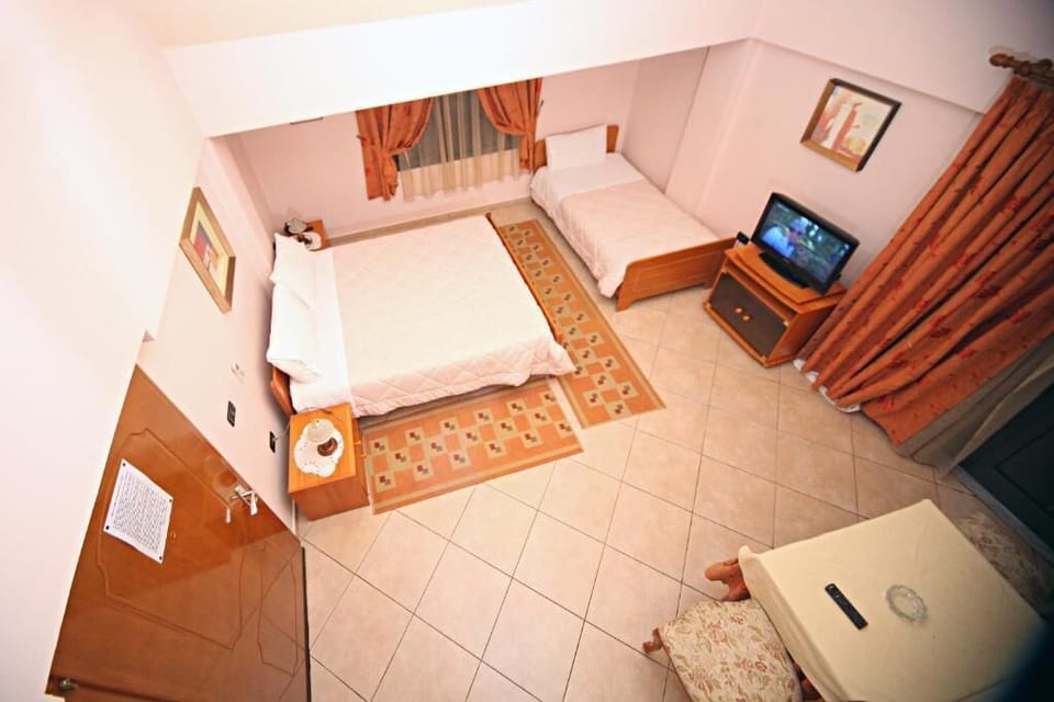 Triple Room, Balcony, Sea View | Desk, iron/ironing board, cribs/infant beds, travel crib