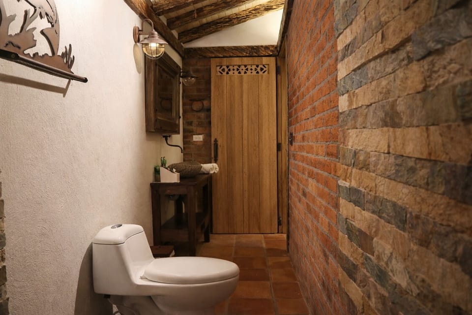 Separate tub and shower, jetted tub, rainfall showerhead, towels