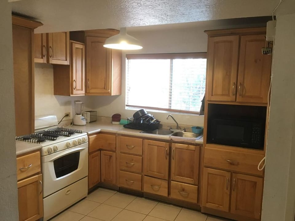 Deluxe Apartment, Garden View | Private kitchen | Fridge, microwave, oven, stovetop