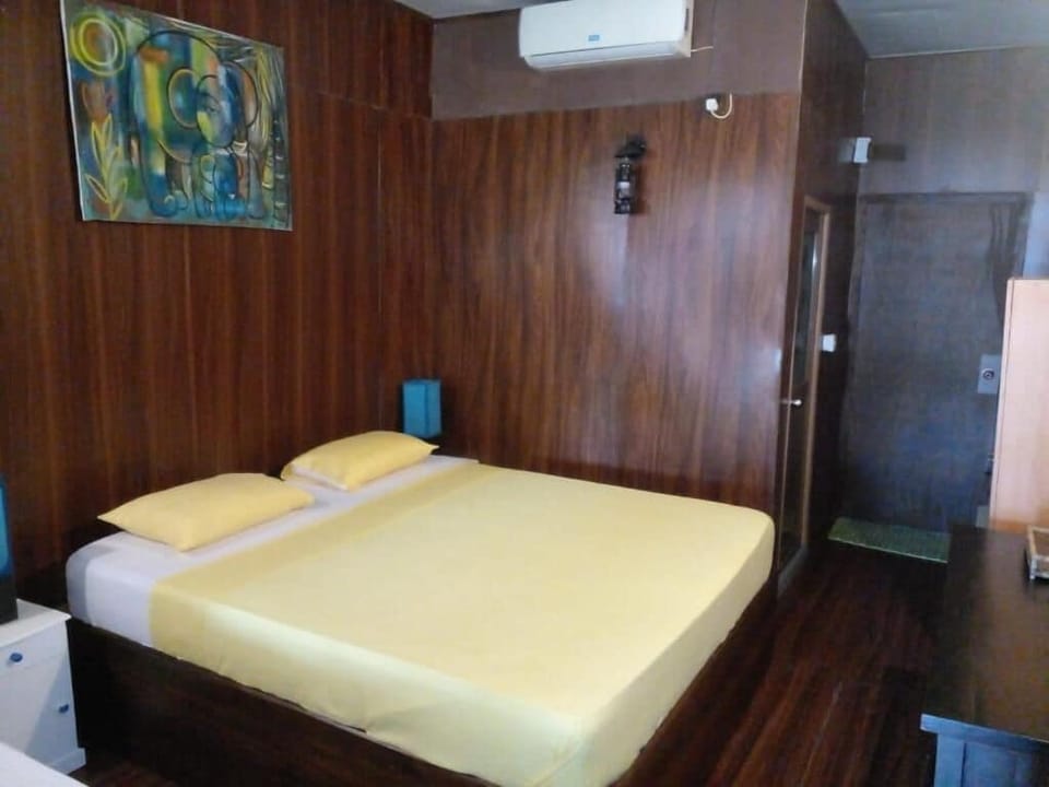 Economy Triple Room, Balcony, Garden View | Desk, laptop workspace, free WiFi