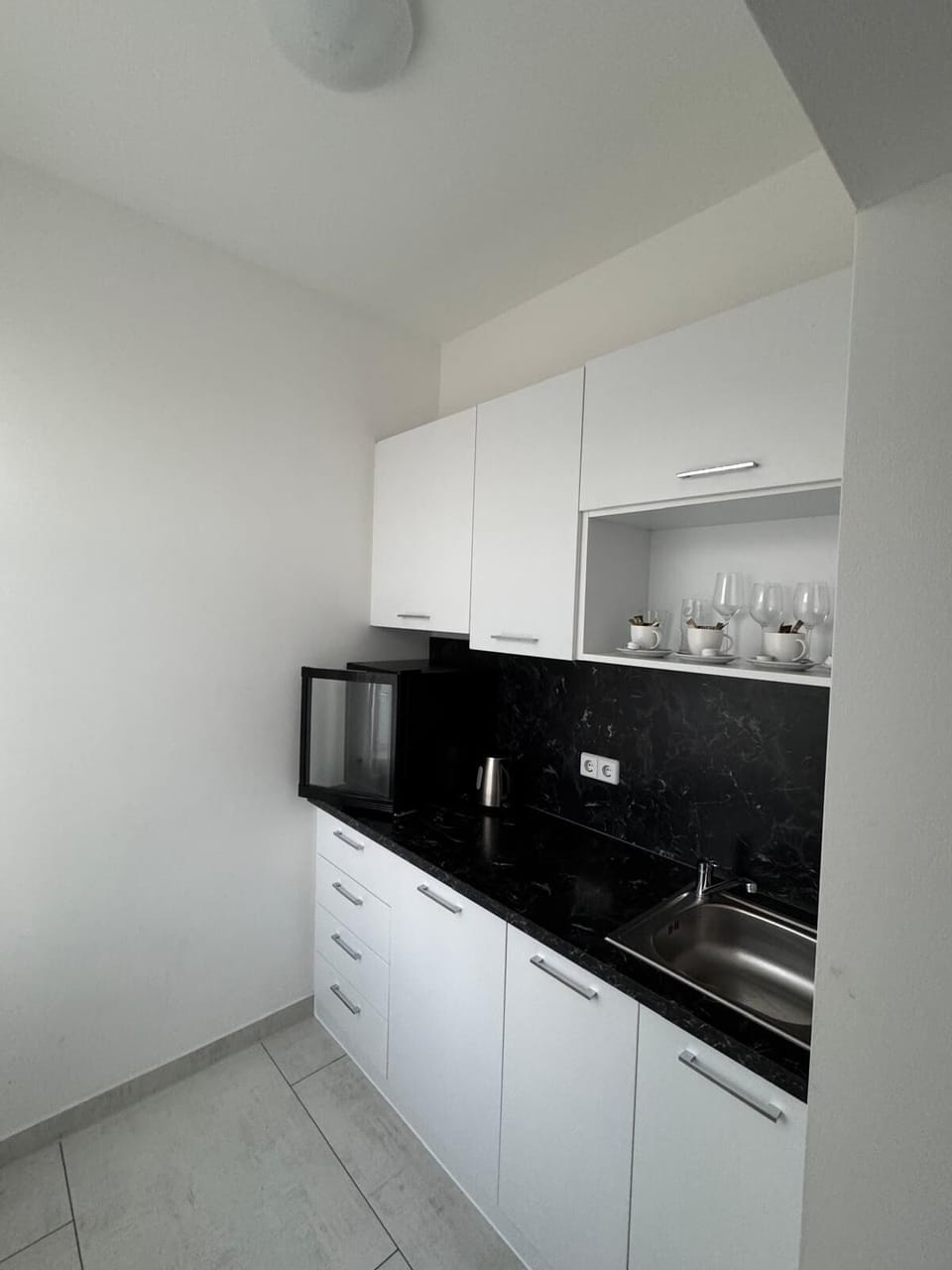 Family Apartment | Private kitchen | Electric kettle, highchair