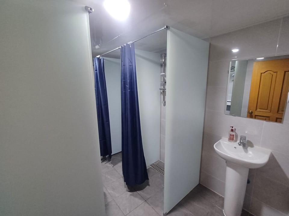 Shower, free toiletries, hair dryer, slippers