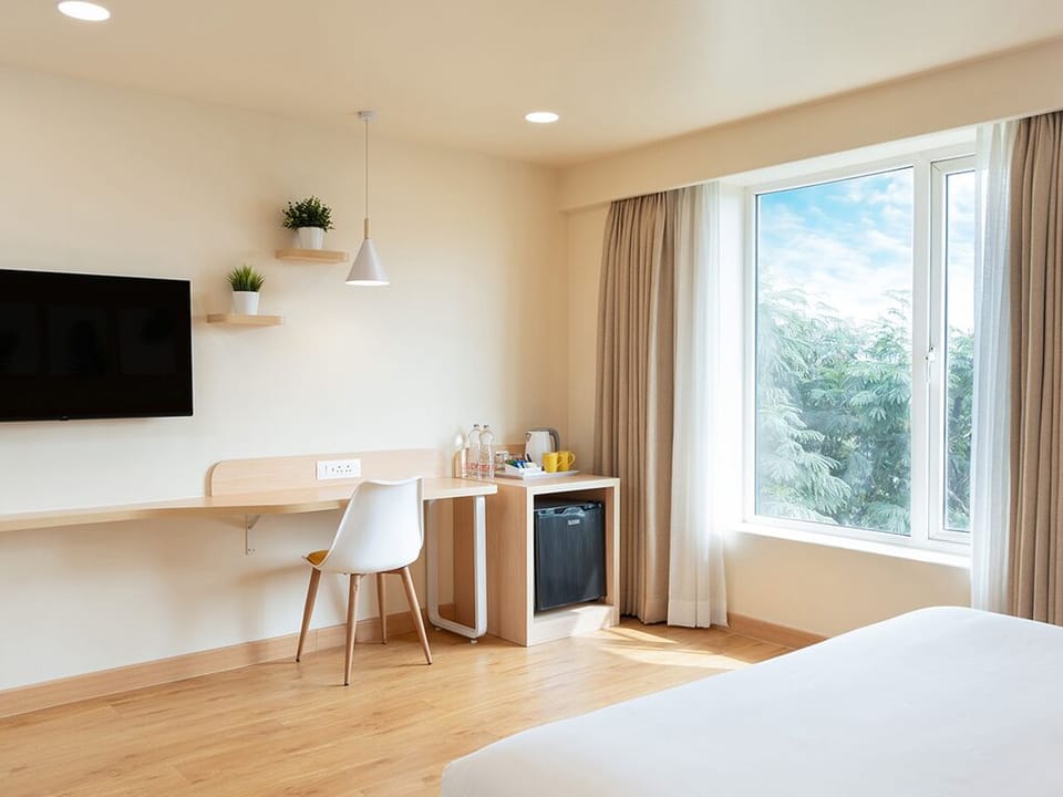 Deluxe Double Room, City View | In-room safe, desk, laptop workspace, iron/ironing board