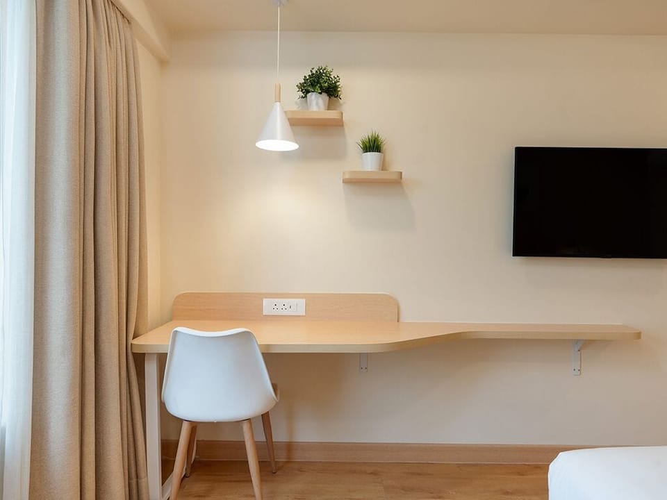 Standard Double Room, City View | In-room safe, desk, laptop workspace, iron/ironing board