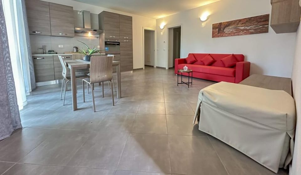 Comfort Apartment | Living area | 40-inch Smart TV with satellite channels, Netflix, streaming services