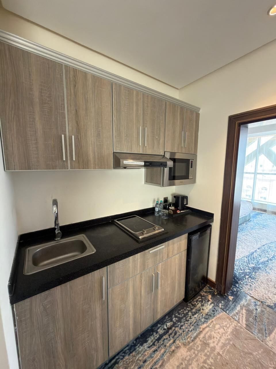 Executive Suite | Private kitchenette | Coffee/tea maker, electric kettle, eco-friendly cleaning products