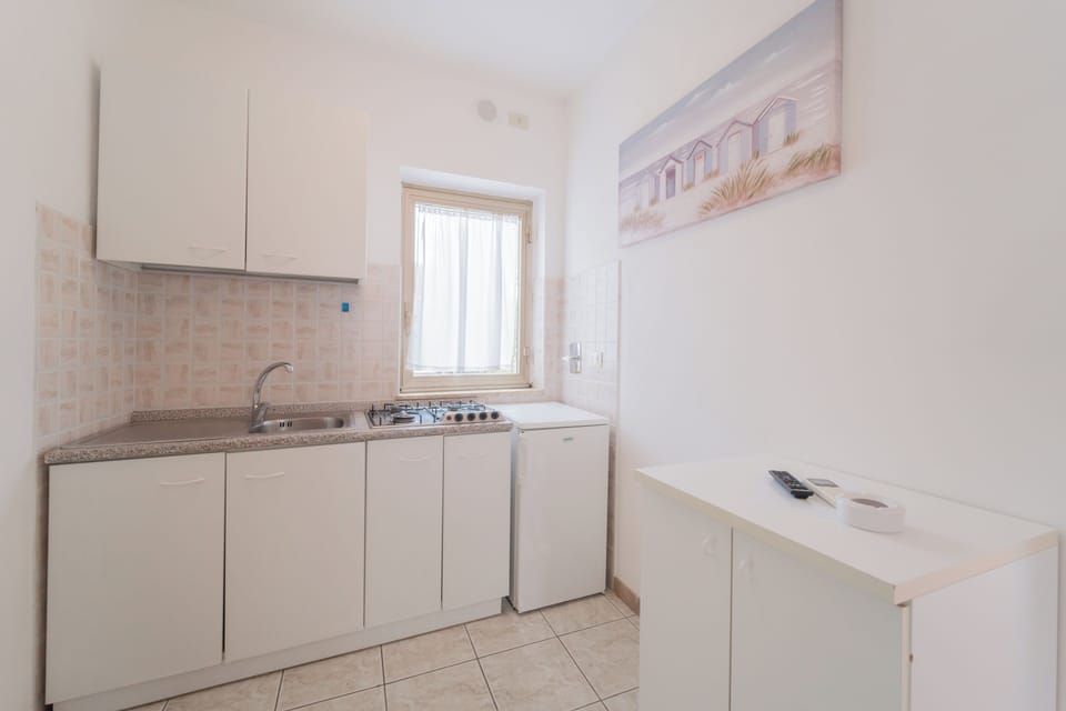 Classic Studio, 1 Bedroom | Private kitchen | Full-size fridge, highchair, cookware/dishes/utensils