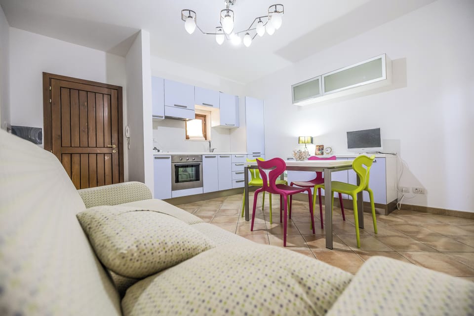 Apartment, 2 Bedrooms, Balcony | Living area | Flat-screen TV
