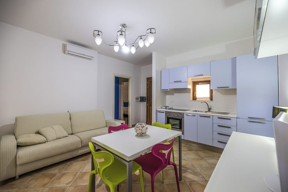 Apartment, 2 Bedrooms, Balcony | Living area | Flat-screen TV