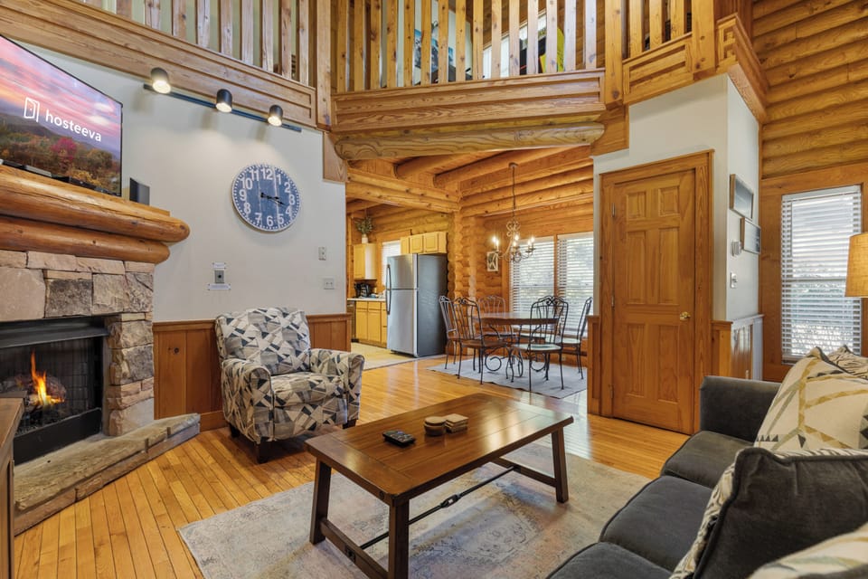 Premium Cabin, 2 Bedrooms, Hot Tub, Golf View | Living room | 50-inch Smart TV with digital channels, fireplace, foosball