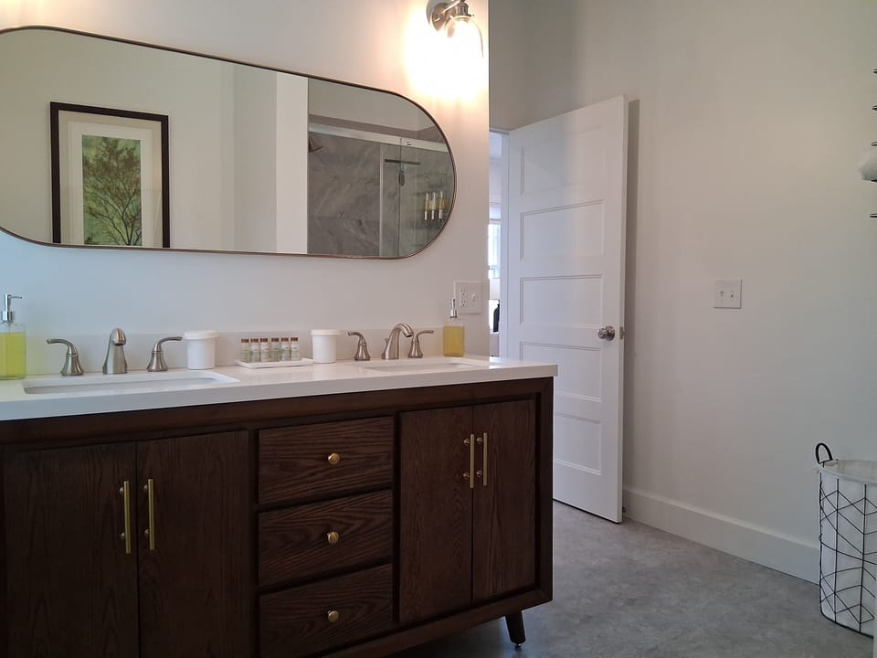 Luxury Apartment, 2 Bedrooms, Refrigerator & Microwave, Partial Ocean View | Bathroom | Combined shower/tub, hydromassage showerhead, designer toiletries