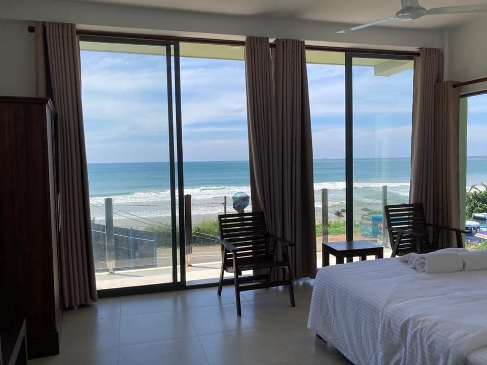 Deluxe Double Room, 1 King Bed, Balcony, Beach View | Desk, laptop workspace, soundproofing, free WiFi