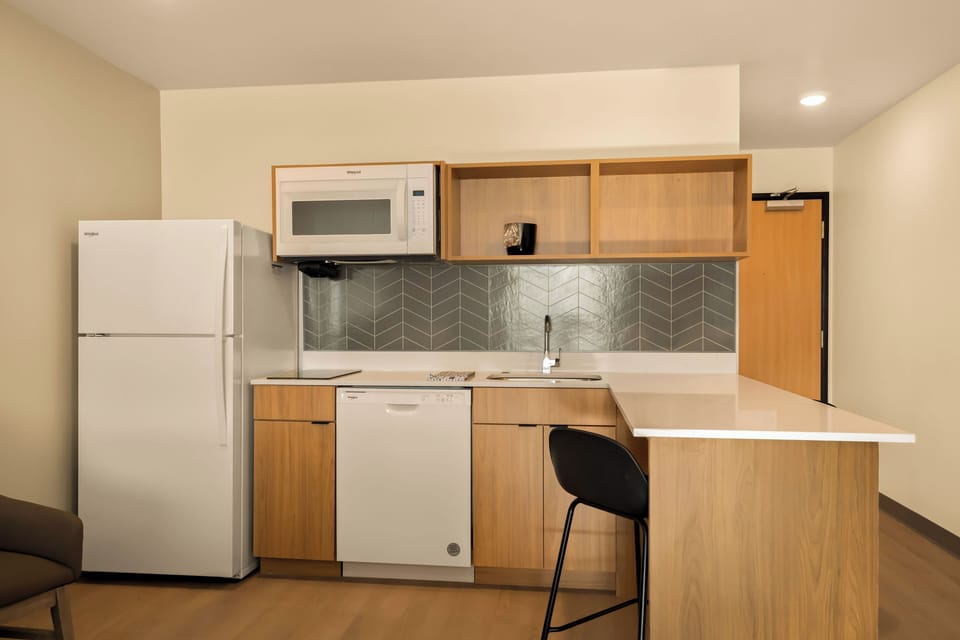 Suite, 2 Queen Beds, Non Smoking | Private kitchen | Full-size fridge, microwave, stovetop, dishwasher