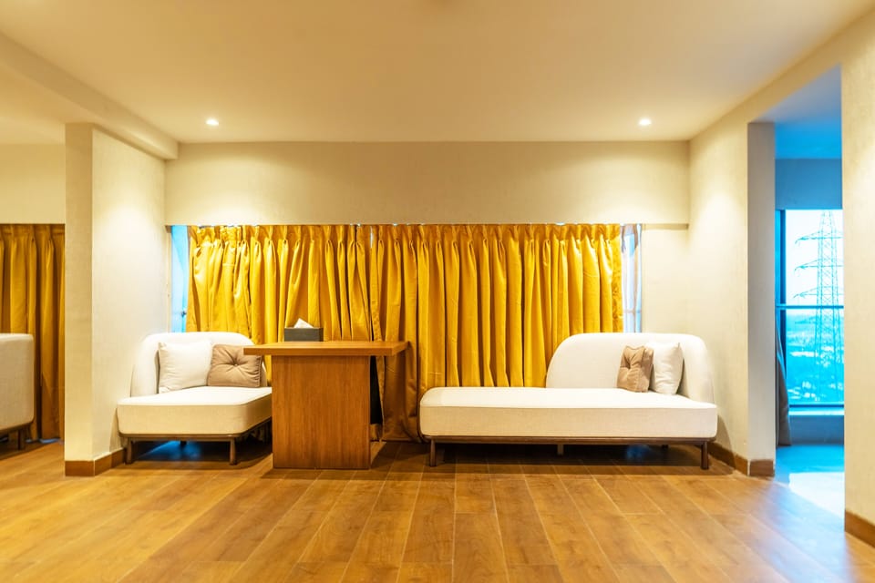 Luxury Suite | Living area | 43-inch LED TV with satellite channels