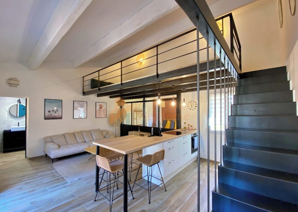 Comfort Loft, Garden View | Living area | 110-cm LED TV with cable channels