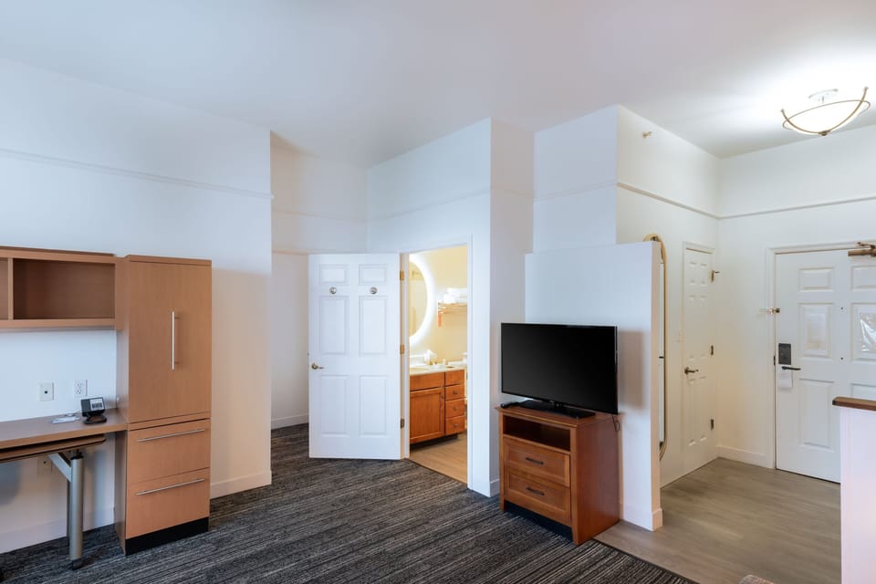 Suite, 1 Bedroom | Hypo-allergenic bedding, desk, laptop workspace, iron/ironing board