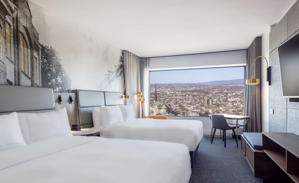Premium bedding, down comforters, in-room safe, desk