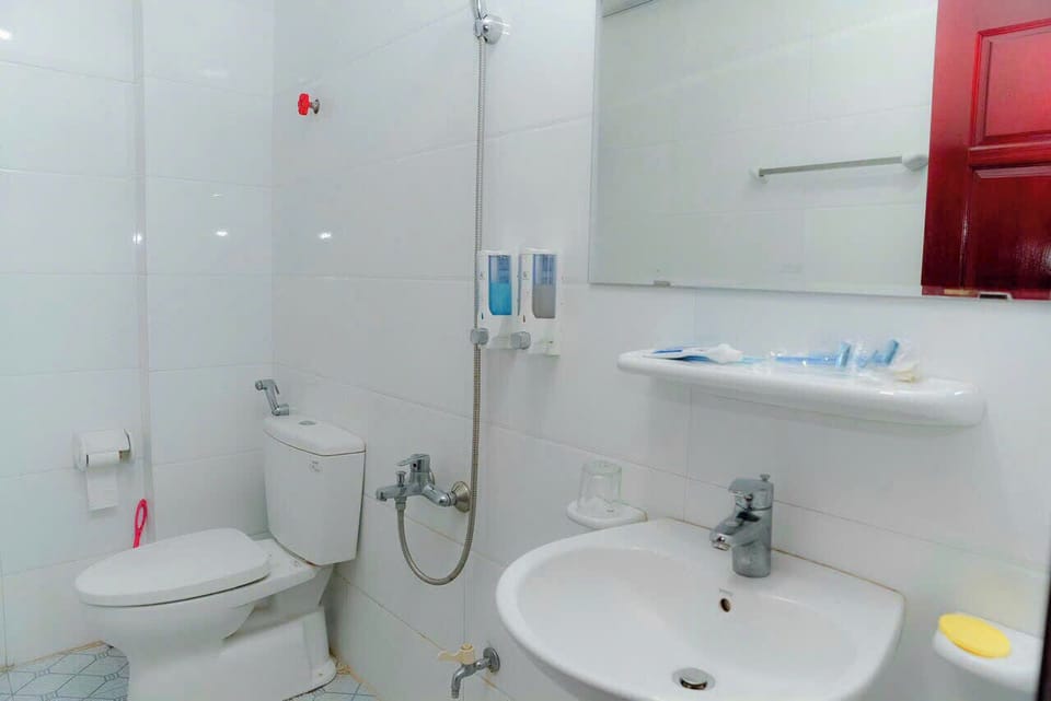 Shower, hair dryer, slippers, towels