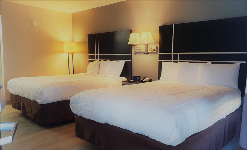 Room, 2 Queen Beds | Individually furnished, desk, laptop workspace, free WiFi