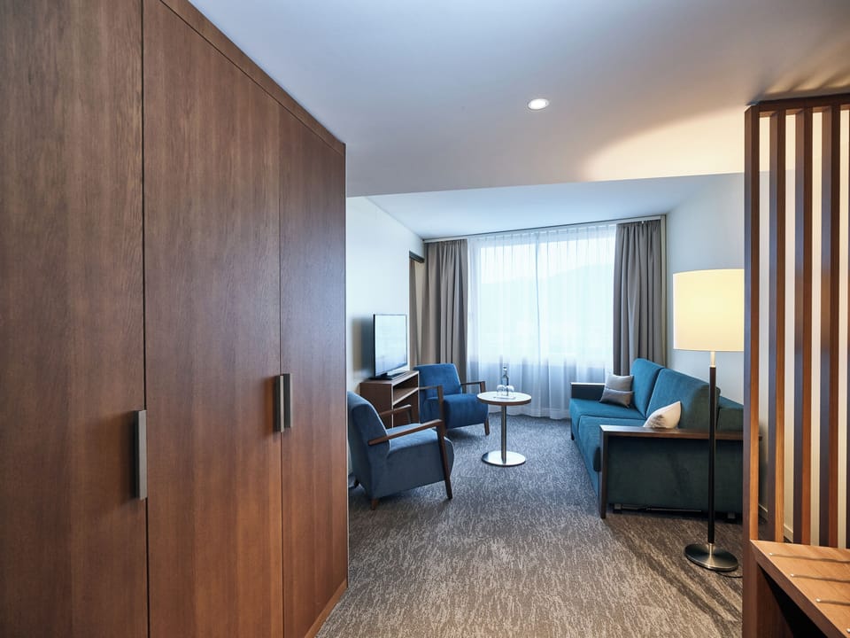Suite, Balcony, Lakeside | Living area | 43-inch flat-screen TV with cable channels, TV
