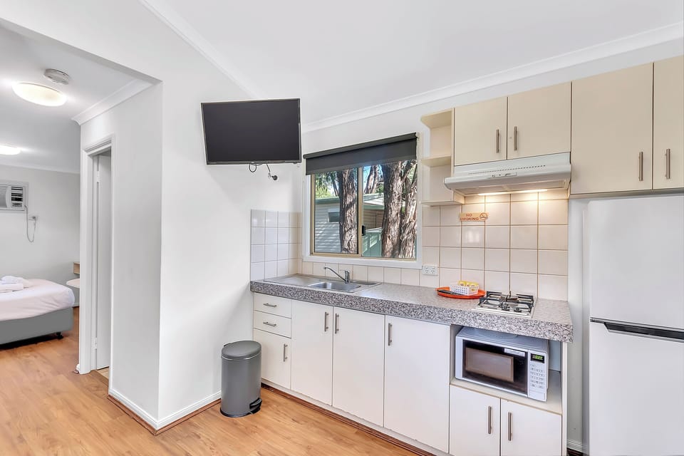 Standard 1 Bedroom Cabin | Private kitchen | Full-size fridge, microwave, stovetop, toaster