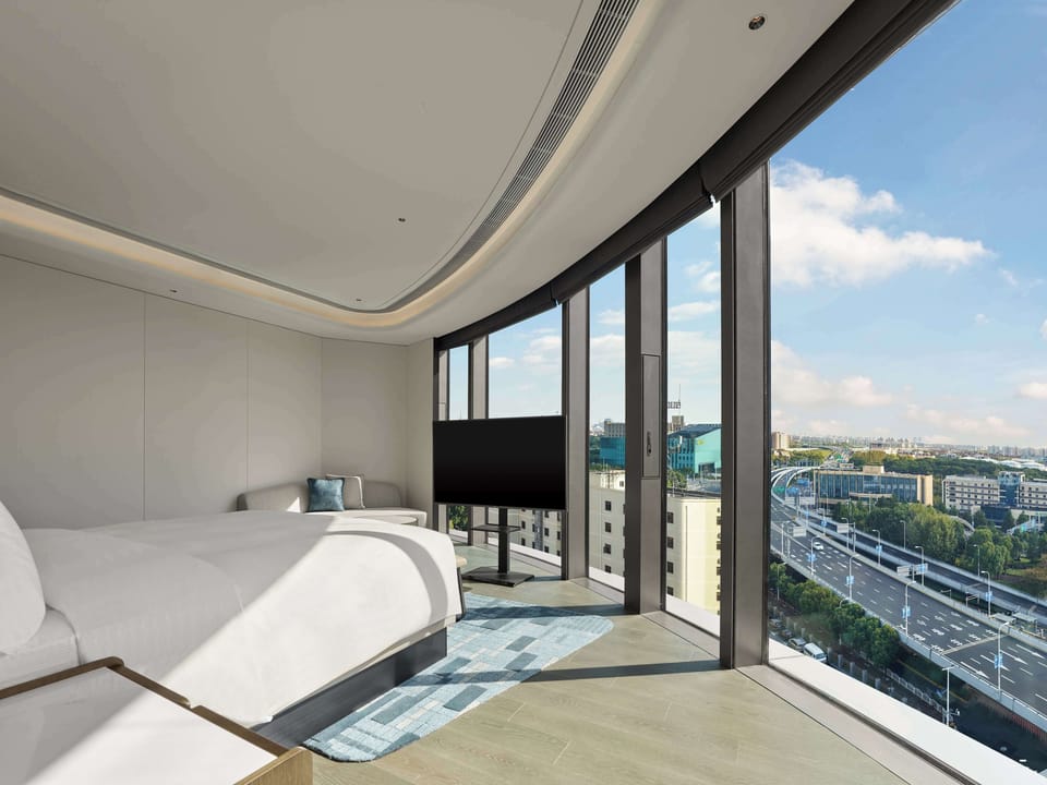 Deluxe Suite, 1 King Bed | Down comforters, minibar, in-room safe, desk