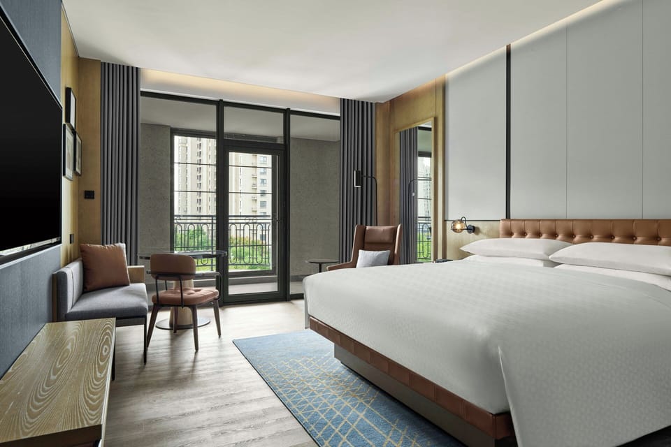 Premium Room, 1 King Bed, Balcony, City View | Down comforters, in-room safe, desk, blackout drapes