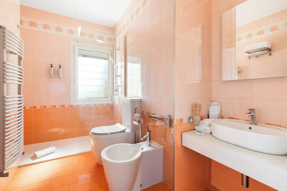 Superior Room | Bathroom | Shower, hair dryer, bathrobes, slippers