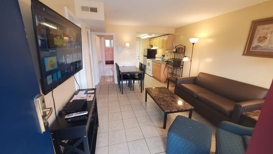 Apartment, 2 Bedrooms | Living area | 32-inch LED TV with cable channels, TV, MP3 dock
